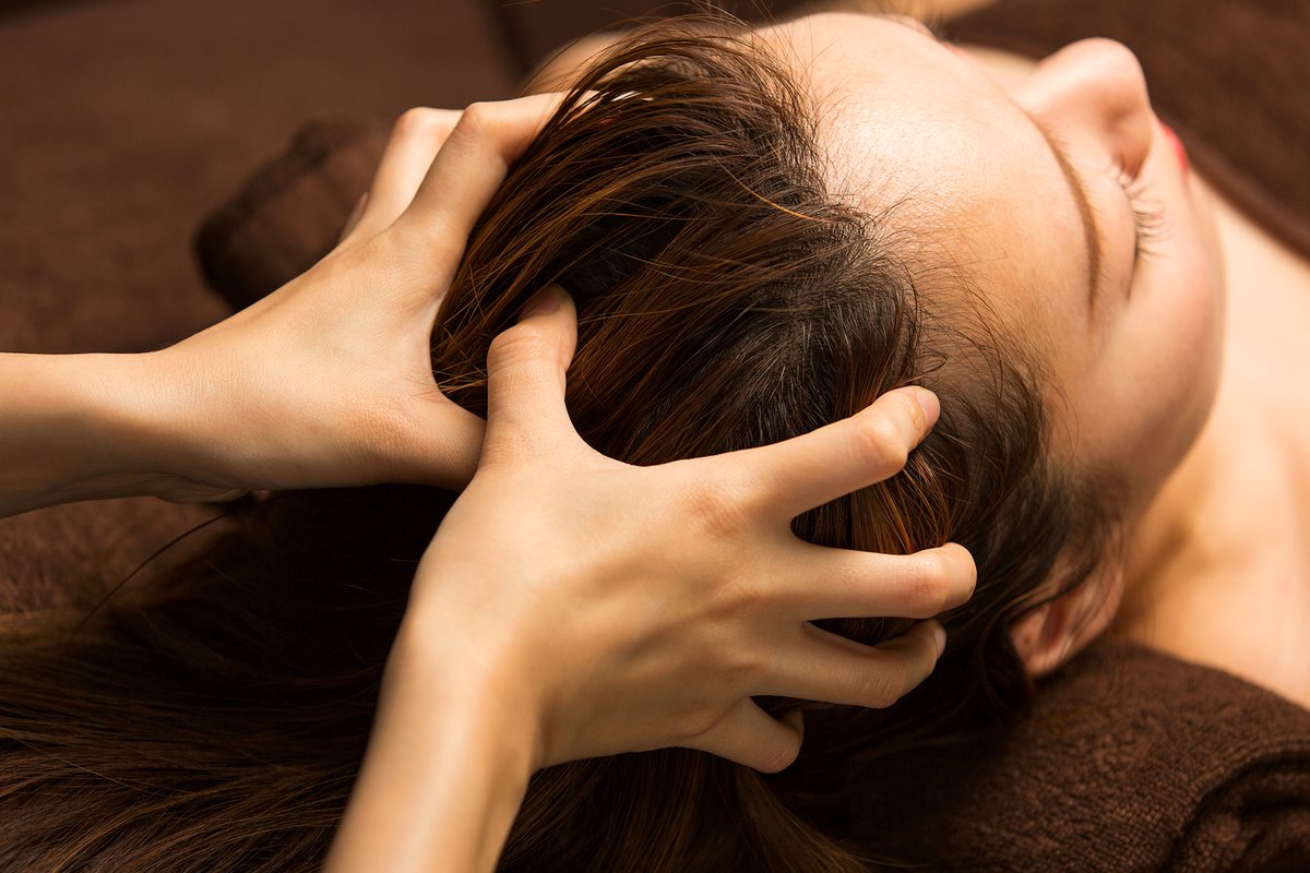 A calming hands-on scalp massage